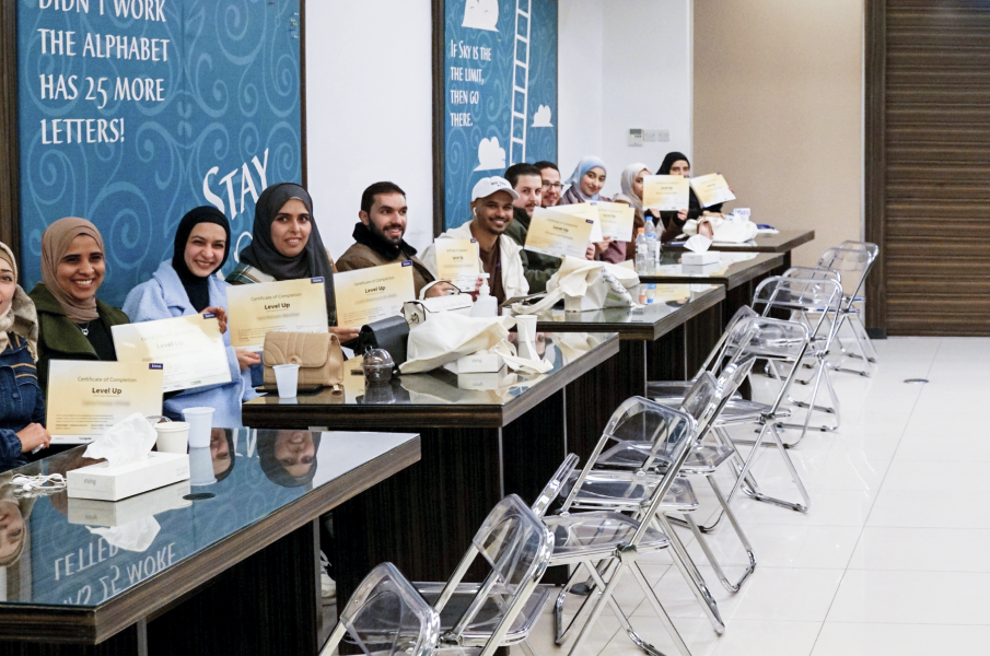 A group of happy graduates showing their course certificates